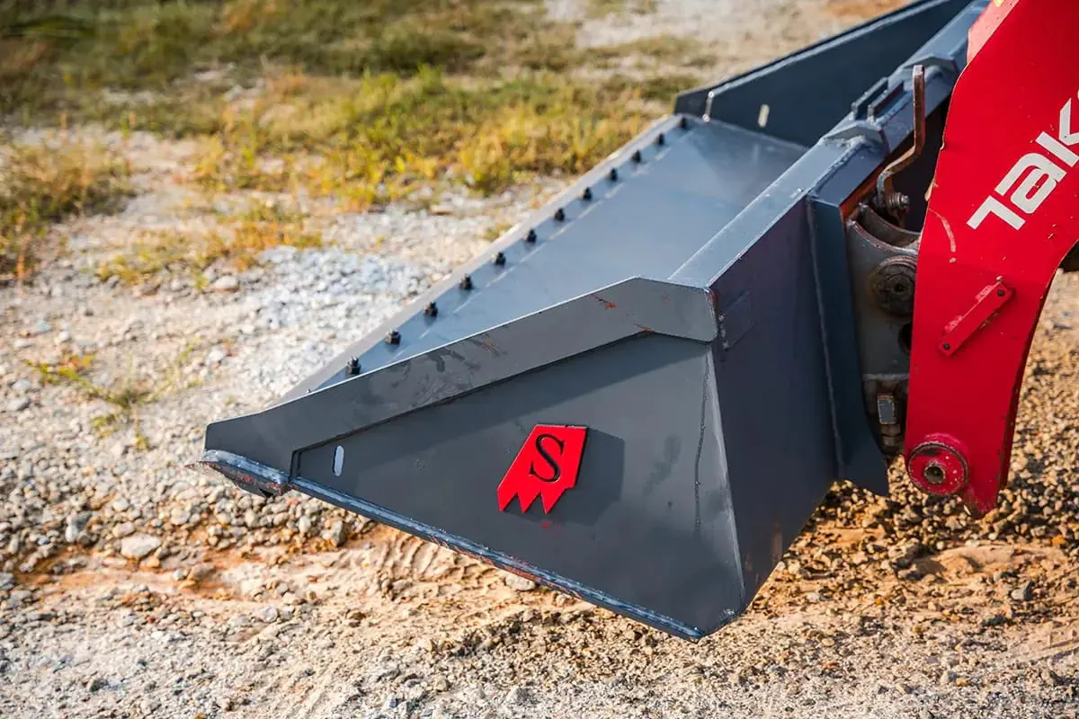Skid Steer Bolt On Edge Bucket on Takeuchi TL10V2 in Mud - Solesbee's Equipment