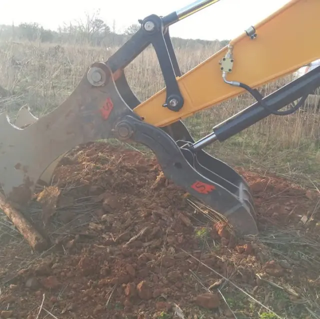 Land clearing timelines get eaten alive by root removal. Our Excavator Stump Puller cuts that time down by using the machine's own hydraulic force instead of an operator fighting with a bucket.

The attachment mounts to the stick, sets its teeth under the stump, and pulls straight up using cylinder leverage rather than digging force. 

On a job clearing a full acre, that difference between digging around each stump and pulling it in one motion adds up to real hours saved, which on a billed clearing job means real margin protected.