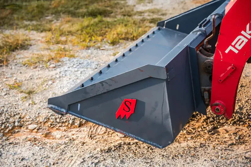 Skid Steer Bolt On Edge Bucket on Takeuchi TL10V2 in Mud - Solesbee's Equipment